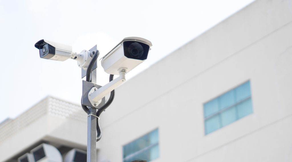 CCTV surveillance security camera video equipment on pole outdoor - Wheelers